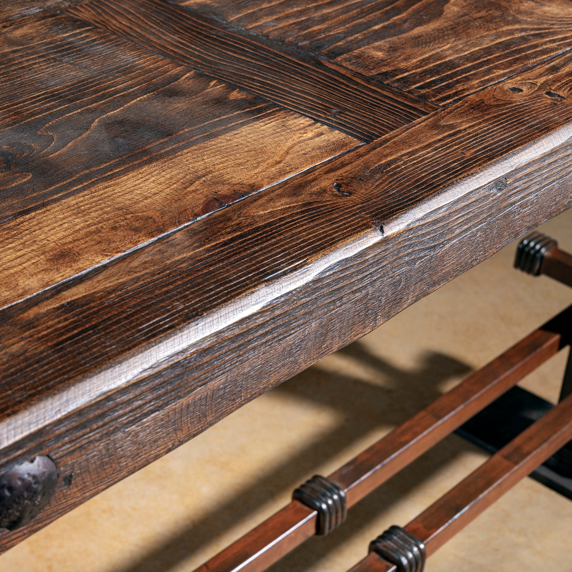 Detail of reclaimed wood top on the Spur Line Iron Console Table showing rich grain and distressing