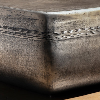 Sterling Range Forge Low Western Metal Coffee Table western coffee table with a low sculptural form, softened corners, and silver finish.