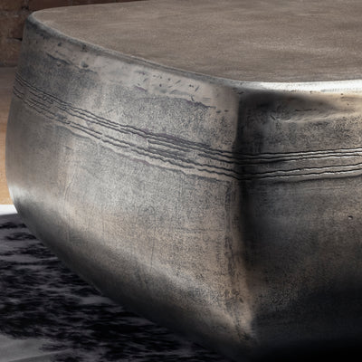 Sterling Range Forge Low Western Metal Coffee Table western coffee table close-up with hand-worked top texture and burnished metal edge.