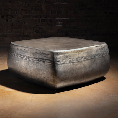 Sterling Range Forge Low Western Metal Coffee Table western coffee table with a low sculptural form, softened corners, and silver finish.