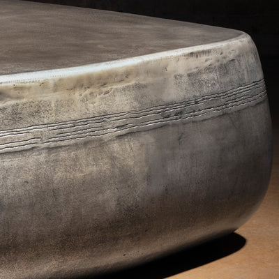 Sterling Range Forge Low Western Metal Coffee Table western coffee table close-up with forged banding, silver patina, and softened corner.