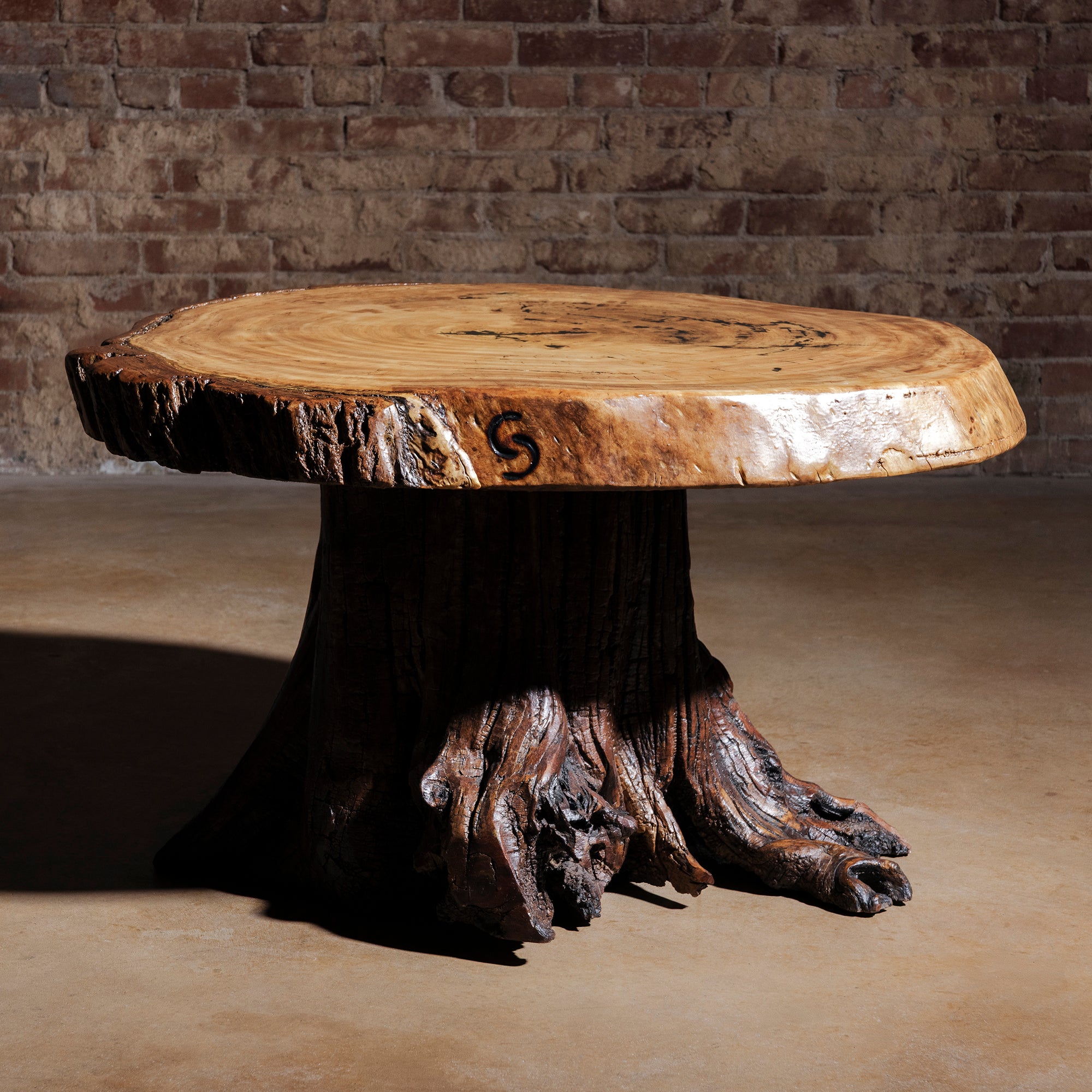 Moody lighting view of Sundermill Rootstone Table live-edge Western coffee table