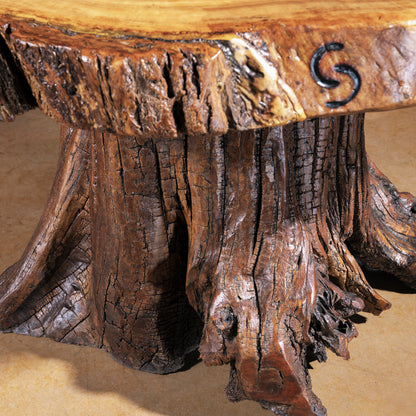 Root-formed pedestal base of Sundermill Rootstone Table with textured wood detail