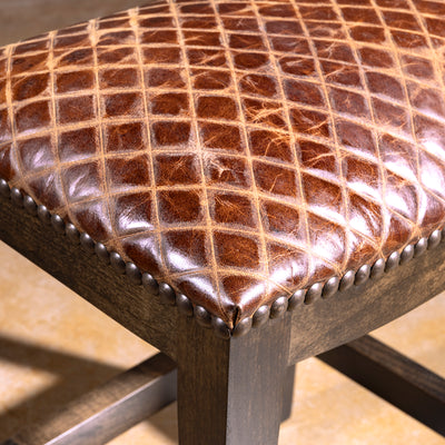 Tascosa Saddle Stool western saddle stool with embossed top-grain leather, antique nailheads, and solid alder wood base