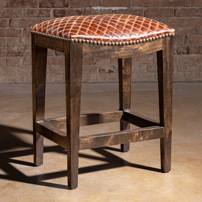Tascosa Saddle Stool rustic Western saddle stool with antique nailhead border, padded leather seat, and alder base
