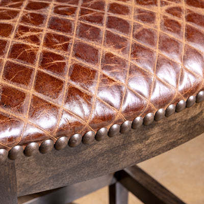 Tascosa Saddle Stool western leather bar stool with backless saddle seat, dark alder wood frame, and nailhead trim