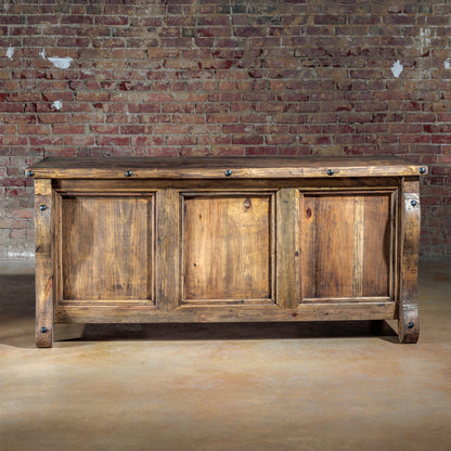 Front angle of The Telluride Executive Desk with serpentine legs and paneled front