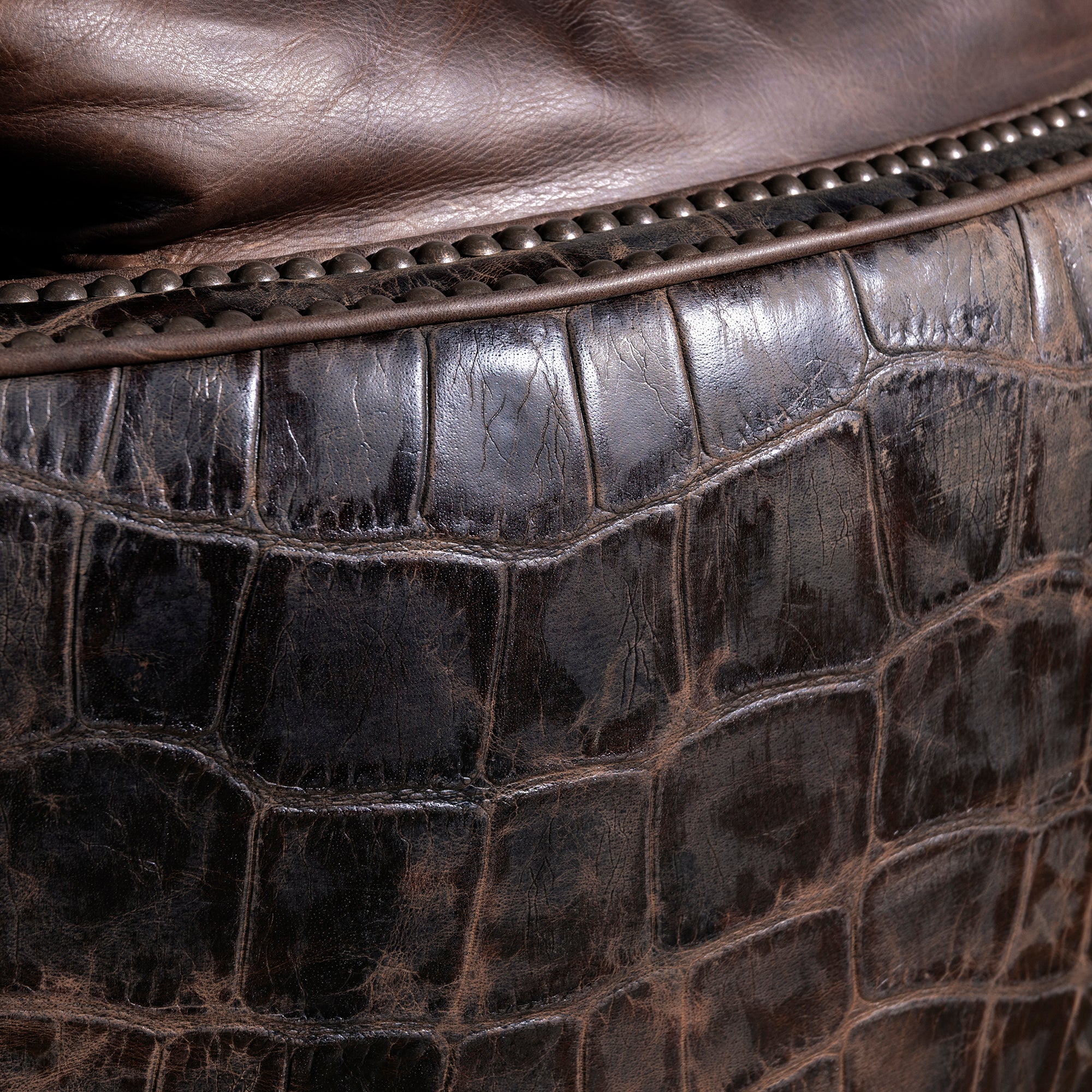 Croc embossed hide texture close-up on luxury Western recliner – Into The West
