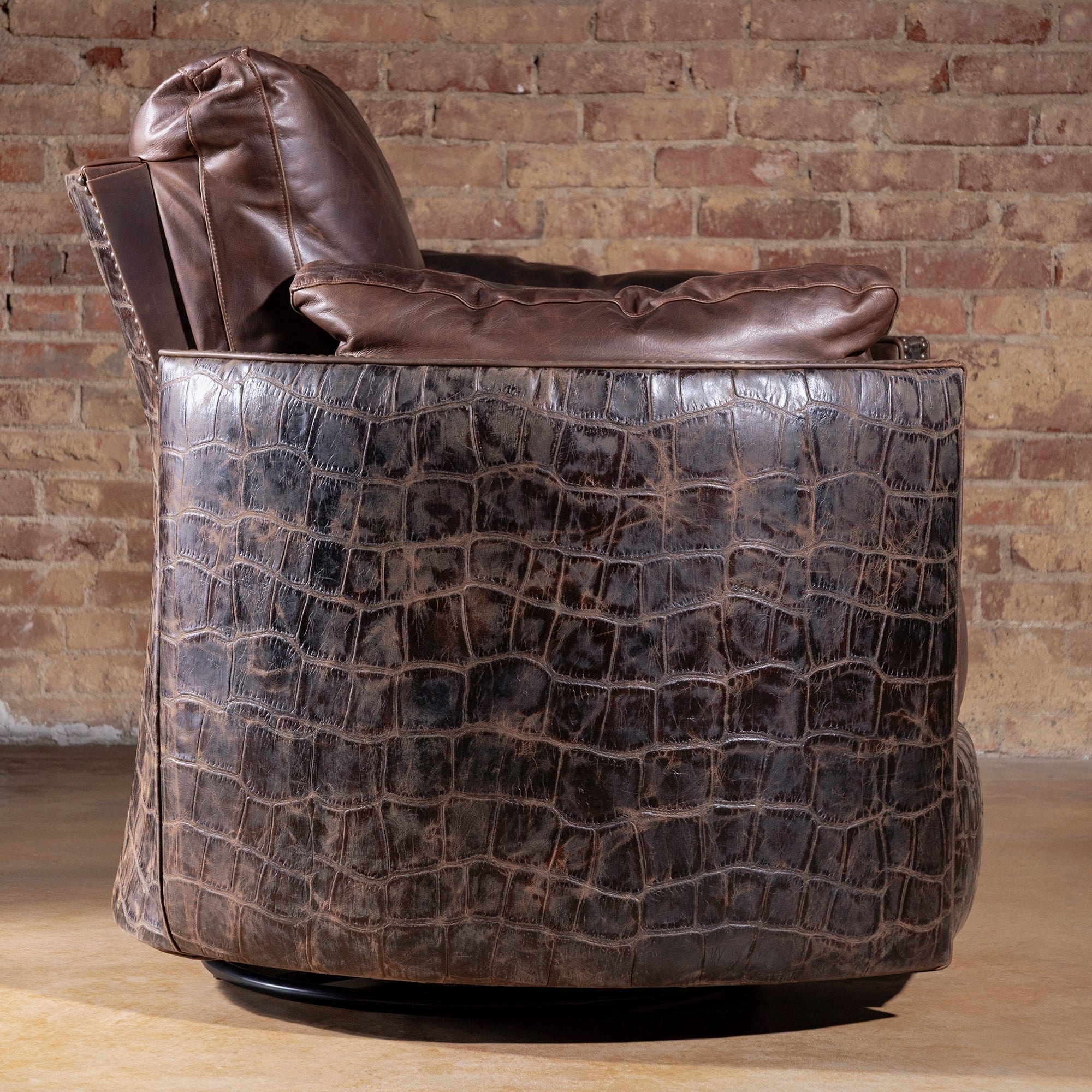 Side view of The Outrider Croc Cuddler Recliner showing embossed croc leather – Into The West