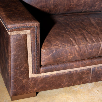 Handcrafted Western-style sectional sofa in top-grain leather with rustic texture and deep seating