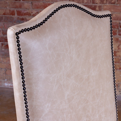 Hand-applied antique nailhead trim on Western leather dining chair