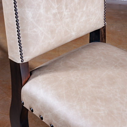 Seat detail of Sonora Highback Dining Chair in creamy top-grain leather