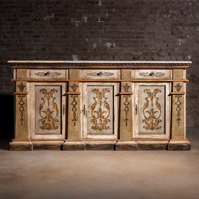 Valencia Crest Heirloom Buffet western buffet sideboard shown closed with three drawers, three doors, and painted old-world panels.