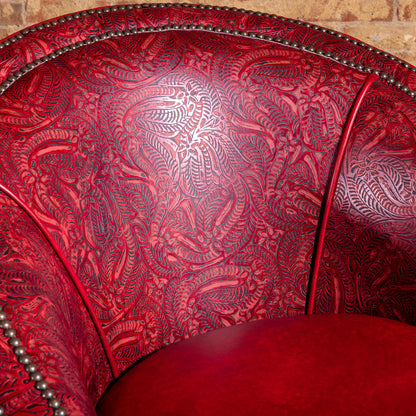 Closeup of floral tooled red leather backrest on Vaquera Royale Western accent chair