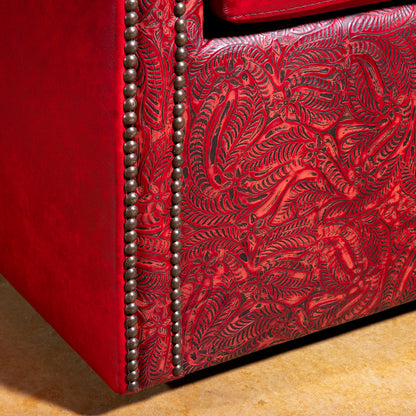 Base panel tooling and nailhead detail on Vaquera Royale red tooled leather swivel chair