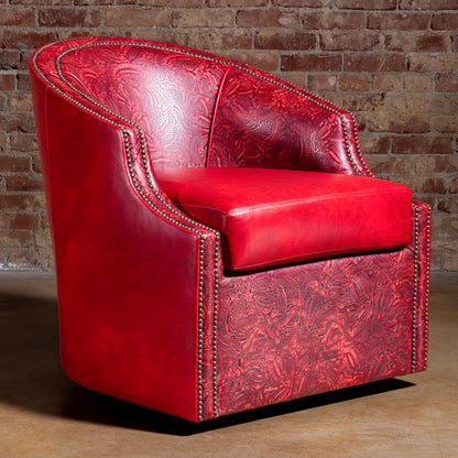 Three quarter hero view of Vaquera Royale red tooled leather Western swivel chair