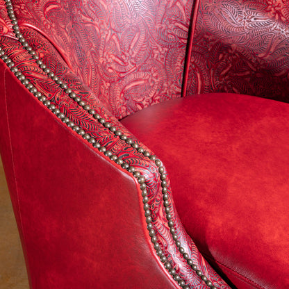Closeup of floral tooled red leather backrest on Vaquera Royale Western accent chair
