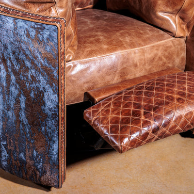 Close-up of antique nailhead trim and brindle hide on Space Cowboy recliner