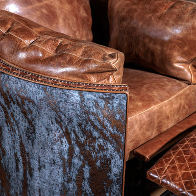 Close-up of antique nailhead trim and brindle hide on Space Cowboy recliner