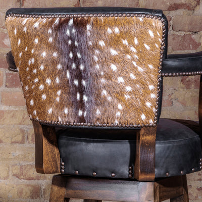 Back of bar stool featuring authentic axis hide and nailhead trim