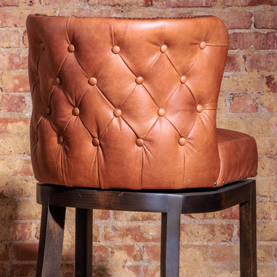 Tufted leather outside back on handcrafted Western curved bar stool