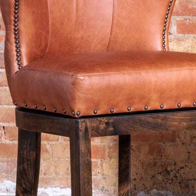 Close-up of memory swivel base and solid wood frame on Western bar stool