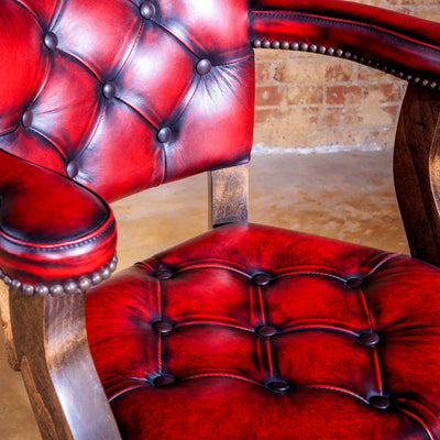 Hand-rubbed red leather and tufting on luxury bar stool