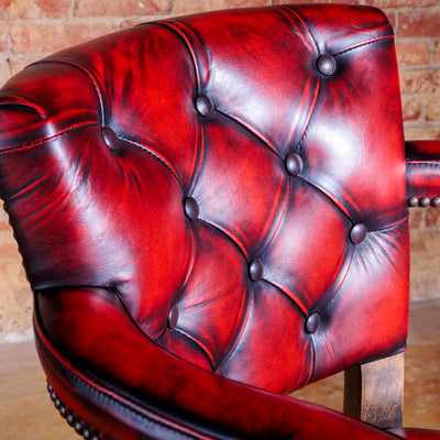 Western bar stool with sculpted crimson leather back and nailhead trim