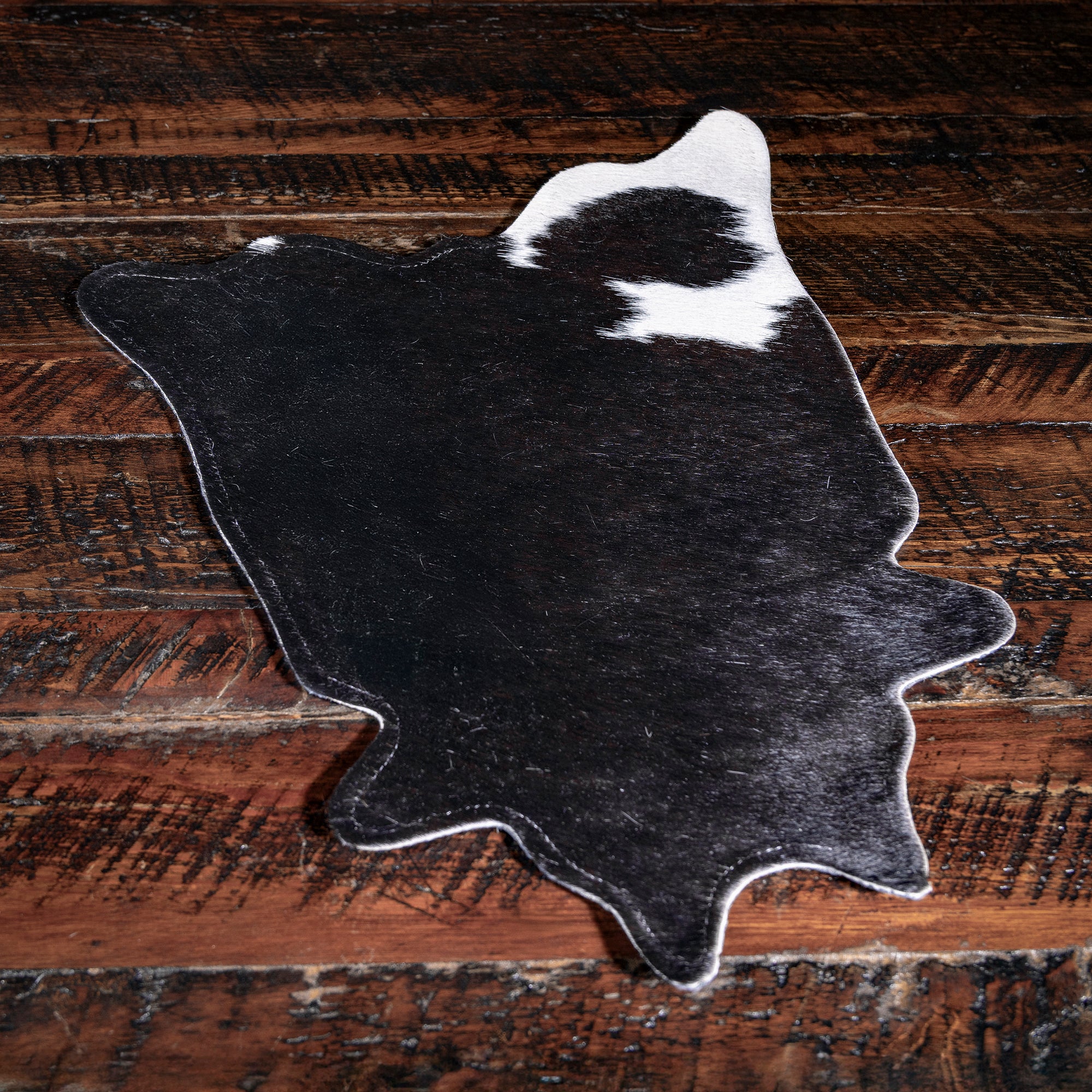 One-of-a-kind Western cowhide placemat — luxury ranch dining and hostess gift idea.