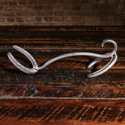 Hand-forged iron horseshoe hat rack from Into The West — rustic Western cowboy home décor piece.
