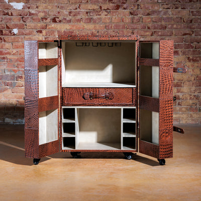 Western luxury bar cart with wine bottle storage and suede-lined cabinet doors open