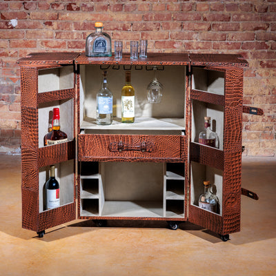 Western luxury bar cart with wine bottle storage and suede-lined cabinet doors open