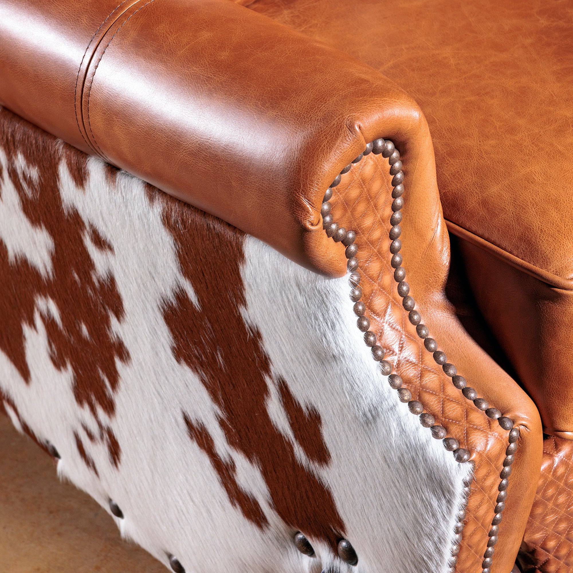 Detail view of the western leather cowhide recliner nailhead detail