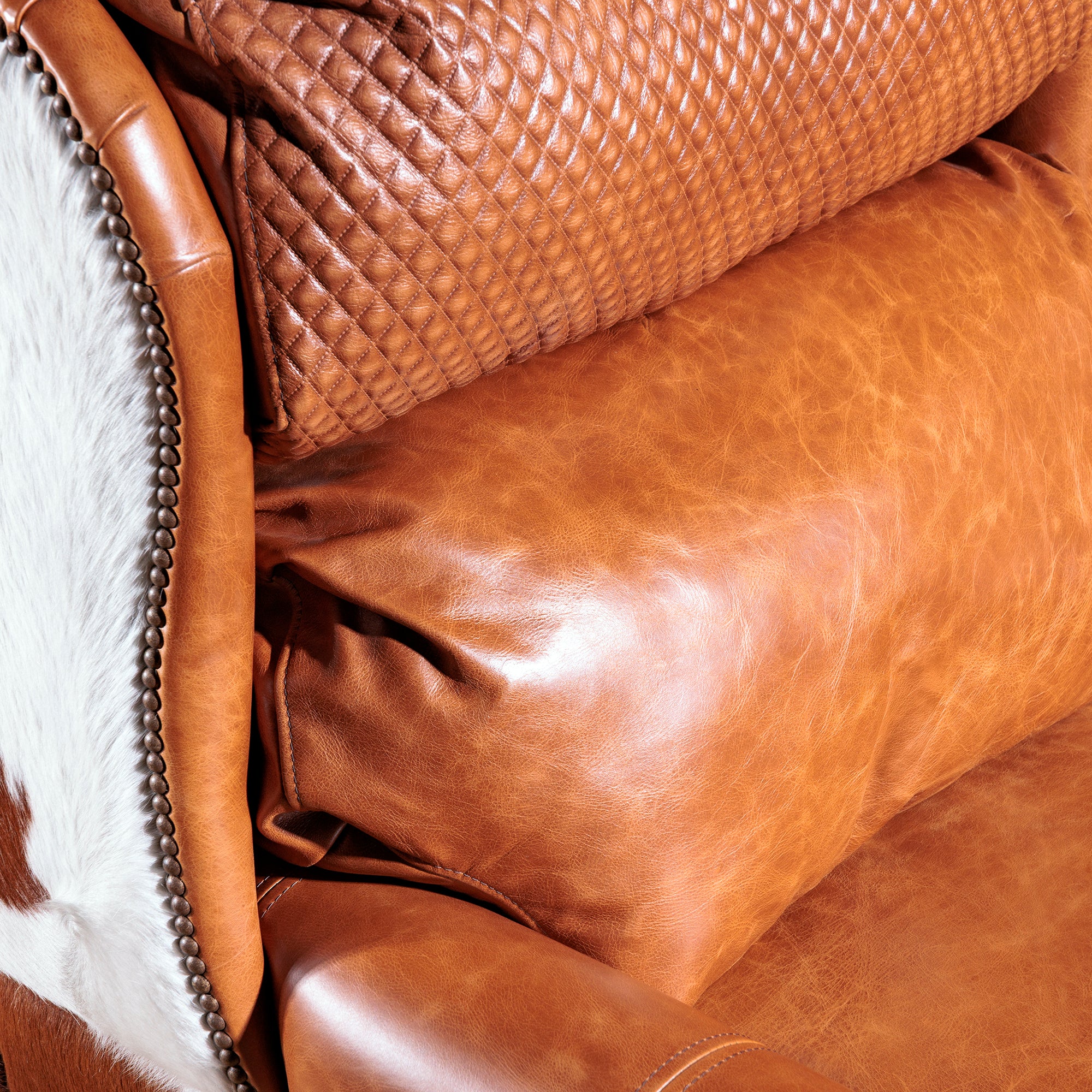 Detail view of the western leather cowhide recliner seat back detail