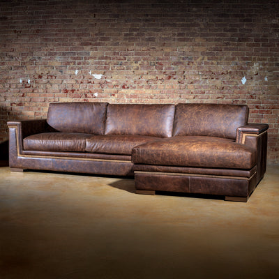 Luxury ranch-inspired leather sectional with chaise, designed for lodge or mountain home interiors