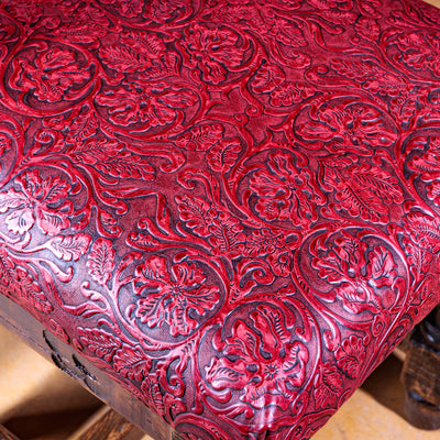 Hand-tooled red leather floral seat detail on Western ladderback chair