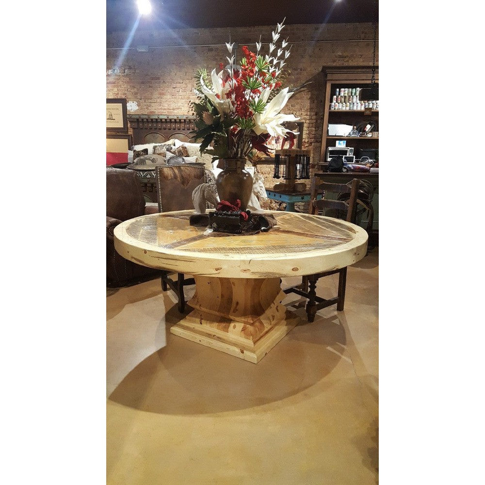 Add an unmistakable rustic elegance to your style with the Old Fashion Round Dining Table. Crafted from solid reclaimed wood and featuring a metal band with nailhead accents and a pedestal base, this handsome piece is designed to pair beautifully with any dining chairs. It's distressed finish complements its timeless, classic look.