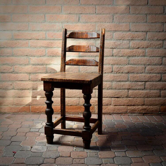 Elevate your space with the Old Fashion Stool. This stylish chair is crafted of reclaimed wood, with a ladder back style for maximum comfort. Perfect for any dining room. 